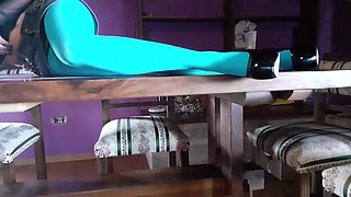 MILF with Beautiful Legs in Pantyhose and Heels Lying on the Table