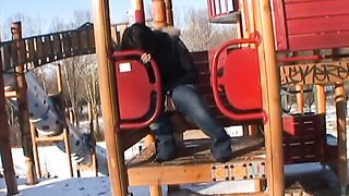 Busty brunette Aisha is having fun with her big black dildo on the sofa