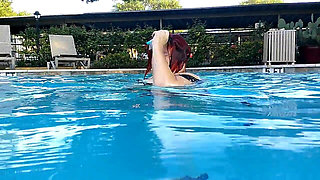 Couple Underwater Diving and Swimming
