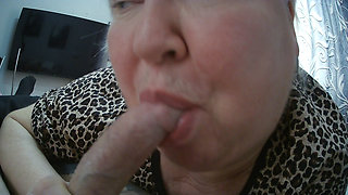 a fat woman makes a deep blowjob sucks balls and looks at a cumming dick