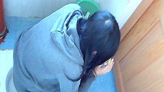 Hot video of an Asian chick pissing in the public toilet