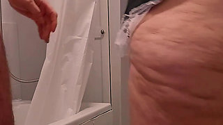 Chubby Milf Maid Bound Ember, gives handjob to hotel guest in rubber gloves then takes a cumshot facial