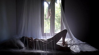 Inside a mosquito net! Beatiful and passionate video