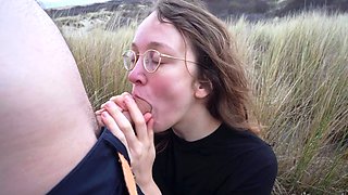 Outdoor handjob on beach with cumshot