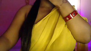 Hot Bhabhi pressed her boobs and gently pinched her nipples while opening her bra.