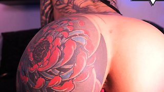 Sexy Inked Chick Wildly Rides Her Sex Doll