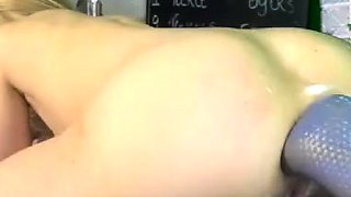 Big dildo machine on her ass