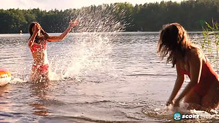 Margo Von Teese and Simona splash each other in their bikinis in a lake before eating each other out on the beach.