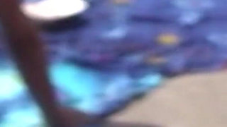 Naked wife on the beach with ass up and doing blowjob is filmed by cuckold