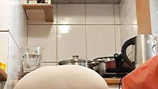 Mature milf in the kitchen cooking for stepson