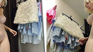 Girl in transparent clothes trying on clothes without panties