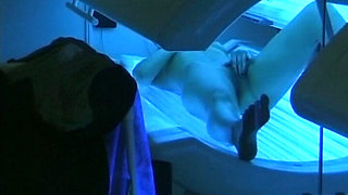 Watch How This German Babe Plays with Her Pussy in Sunbed