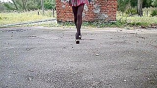 Nylon tights, high heel and school skirt