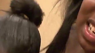 Two black women with natural tits and big asses suck a huge white cock