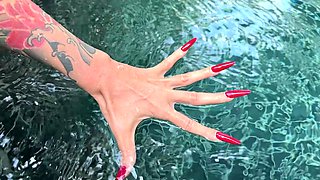 Long Red Nails and Long Fingers in Swimming Pool