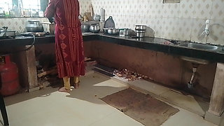 Husband and wife having sex in the kitchen