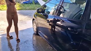 I undress while washing the car at the car wash, showing my tits and pussy in public