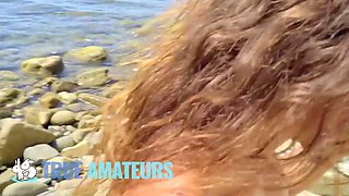 True amateurs - suntanned beauty rides a Big Cock stunningly at the beach not caring if she gets caught