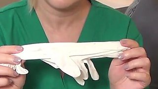 Nurse tries on exam gloves