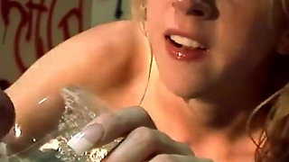 Kelly Wells is getting fucked while sampling cock from multiple glory holes