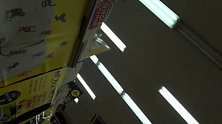 Slender Japanese teen with lovely ass upskirt in the store