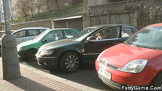 Plump blonde gives head in a car