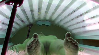 Dark haired beauty in solarium