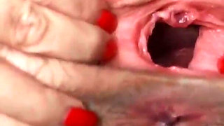 Open pussy using a speculum_orgasm in close up during