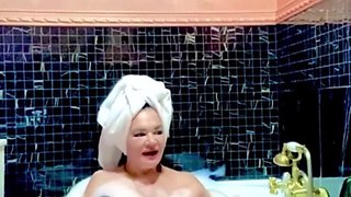 Stepmom Takes a Bath and Plays with Her Big Tits