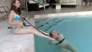 mistress using slave in swimming pool