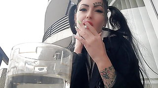 Smoking fetish. Dominatrix Nika smokes sexy and spits into a glass. Imagine that this glass is your mouth.