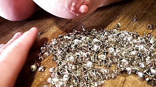 Putting breasts in thumbtacks