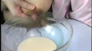 A wet nurse milks her tits