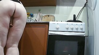 wife masturbates with sex toys in the kitchen