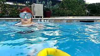 Couple Underwater Diving and Swimming