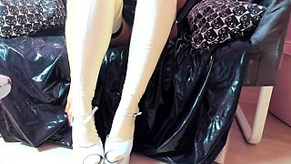 Busty amateur milf wears latex uniform and high heels