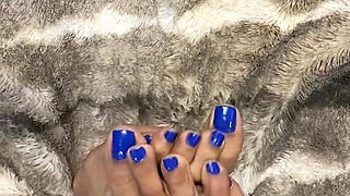 Melove Showing Her Blue Nail Polish on Her Small Feet