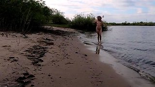 Exhibitionist Blonde Goes Nude on a River Beach