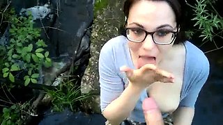 Nerdy girl in glasses sucks cock and eats semen outdoors