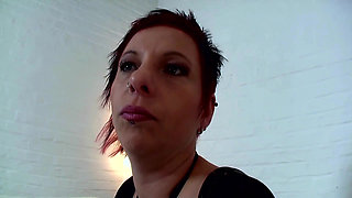 Short red hair pierced lady masturbates in a closeup video