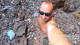 Short-haired tattooed girlfriend gives outdoor beach blowjob