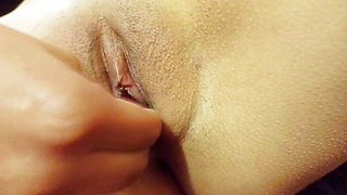 Naked girl touches herself and masturbates having multiple squirting orgasms