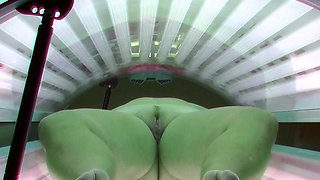 Busty and husky housewife in solarium