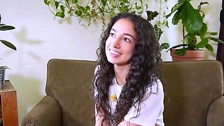 Sexy dark-haired toys with a wand and flashes off her