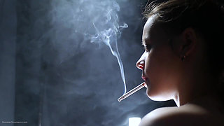 Topless Brunette Smoking in Dramatic Smoke