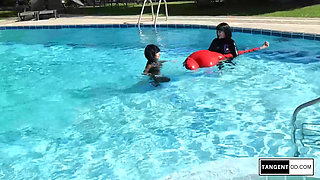 TANGENTOD Women in Black Catsuits Float Red Latex Encased Figure on Inflatable Rubber Pool Toy