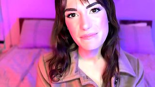 A brown haired doll with immense hooters in black