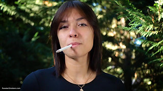 Sweet Russian Beauty Smoking Cigarette in Nature