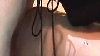 Dominatrix Trains Hooded Slave with Huge Dildo
