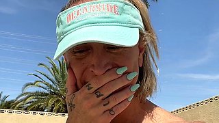 Blonde is flashing her big boobs in the outdoors